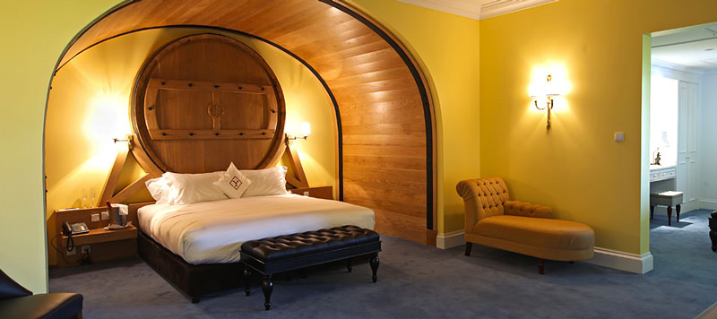 A Bed With A Barrel For A Headboard