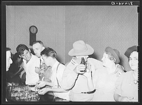 People in advanced stage of inebriation in saloon during National Rice Festival
