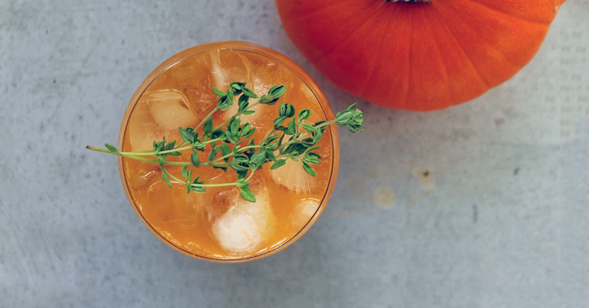 Spice up your fall drinking with this thyme-infused rum-spiked pumpkin cocktail. Get the recipe now!