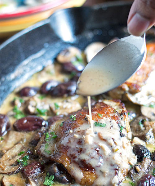 Chicken in white wine cream sauce with mushrooms and olives