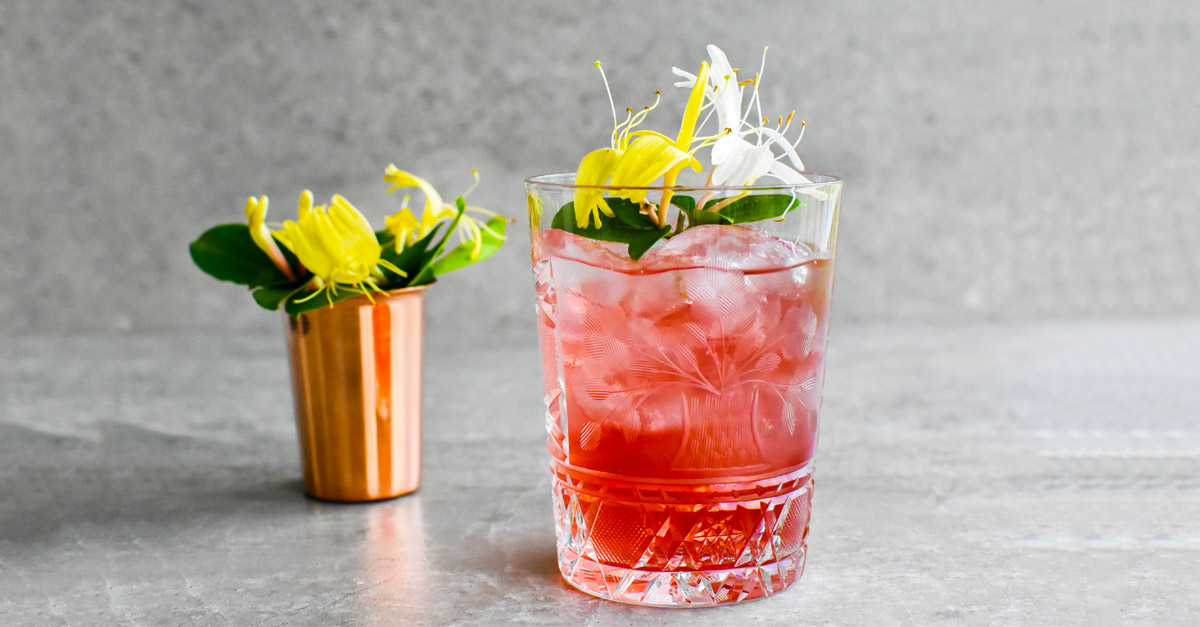 A low-proof, refreshing riff on the classic Old-Fashioned, this summer cocktail uses rose Port and honeysuckle simple syrup. Learn how to make it with this recipe.