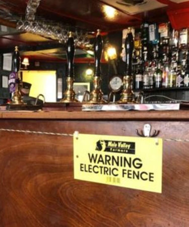 English Pub Installs an Electric Fence to Maintain Social Distancing